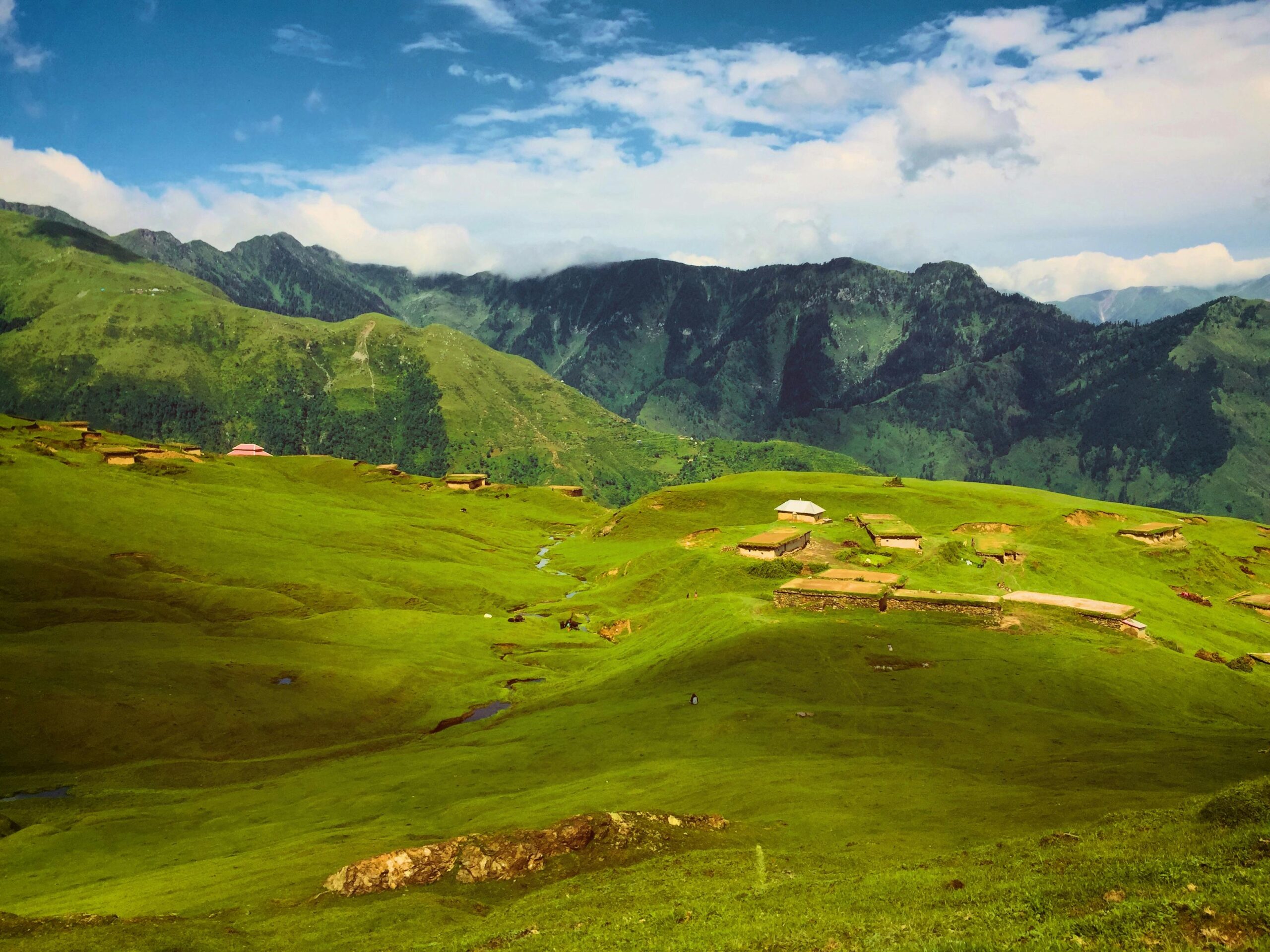 Scenic view of Gurez Valley with green meadows and mountain peaks
