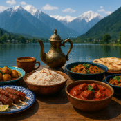 Traditional Kashmiri meal with saffron rice, curry, kebabs, lotus root curry and kahwa on wooden table with mountain lake backdrop